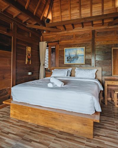 Кровать или кровати в номере Banjar Segara Villa & Guesthouse - Kelating