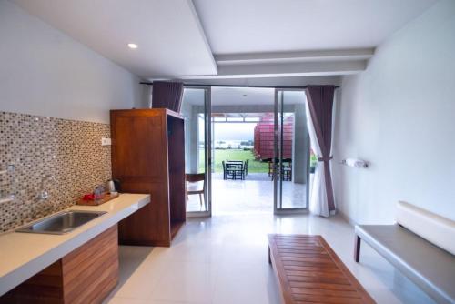 a kitchen with a sink and a counter top at The Joglo Beratan in Bedugul