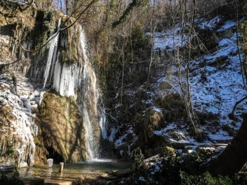 a waterfall on the side of a river at Apartment in Umbria near Lake Trasimeno in Mantignana
