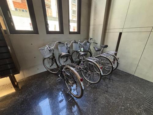 a row of bikes parked in a room at Oplus7 in Toucheng