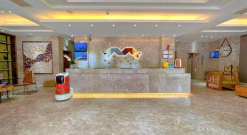 a lobby of a store with a counter in it at Borrman Hotel Huizhou West Lake Shuidong Street in Huizhou