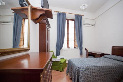 Postel nebo postele na pokoji v ubytování Albergo Stella