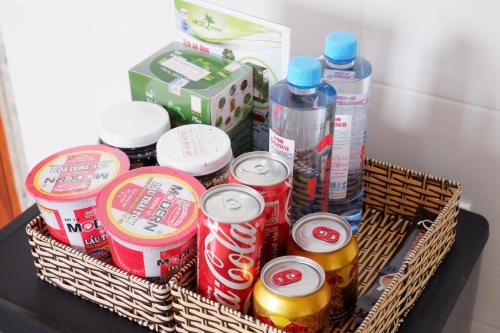 a basket full of drinks and drinks on a table at An Nam Paradise Dalat in Da Lat