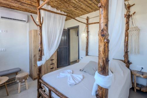 Postel nebo postele na pokoji v ubytování Christos studios and family apartments