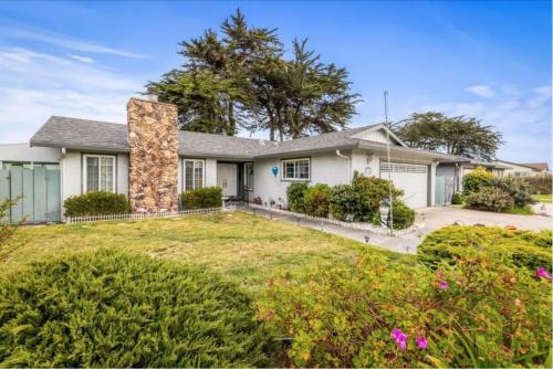 a large white house with a large yard at STR25-15 Master Bedroom Marina in Marina