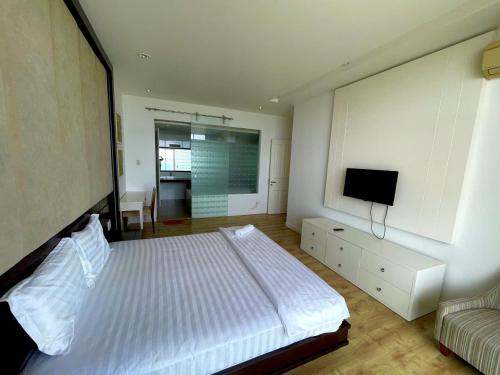 Ένα ή περισσότερα κρεβάτια σε δωμάτιο στο Ocean Vista Beach Front Apartment