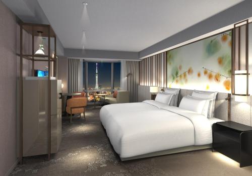 Ένα ή περισσότερα κρεβάτια σε δωμάτιο στο Asakusa View Hotel