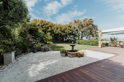 a garden with a fountain in the middle of a yard at View 14 in Auckland