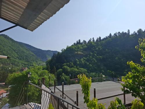 a view of a parking lot with mountains in the background at Borjomi Nest 2 in Borjomi