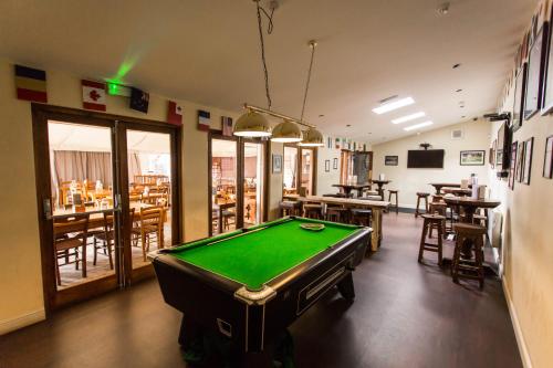 a room with a pool table in a restaurant at The Star Inn in Nottingham