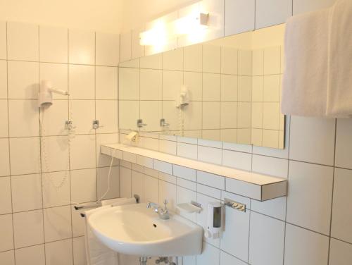 Ванная комната в Brunnen Hotel