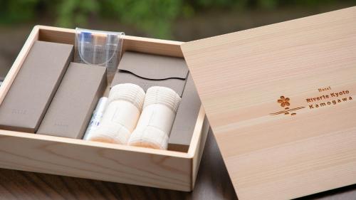 a wooden box filled with pamphlets and a glass at Riverte Kyoto Kamogawa in Kyoto