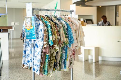 a bunch of shirts on a rack in a store at Naha Tokyu REI Hotel in Naha
