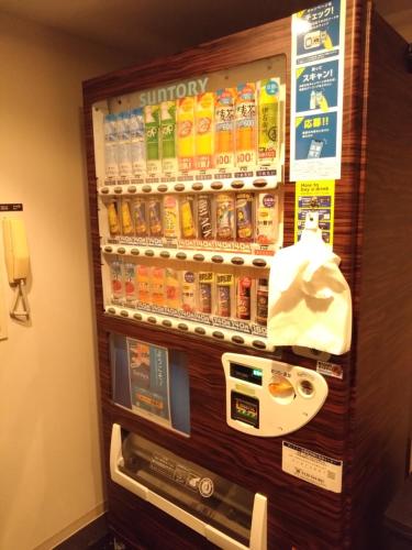 a drink vending machine in a hotel room at Dormy Inn Akita in Akita