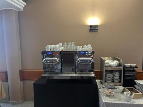 a coffee machine sitting on top of a counter at Hotel San Gerolamo in Vercurago