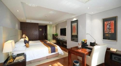 Ένα ή περισσότερα κρεβάτια σε δωμάτιο στο Xian Yohol Hotel