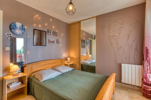 Postel nebo postele na pokoji v ubytování Villa aux portes de la Camargue