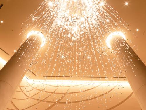 a chandelier hanging from the ceiling of a building at Hotel Universal Port Vita in Osaka