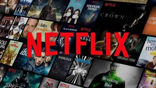 a bunch of books on a shelf with the words netflix at "The House" Апартаменти и Термална зона in Velingrad