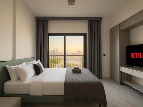 a bedroom with a bed with a view of the city at Burj Khalifa View Studio - 10 mins away Dubai Mall in Dubai