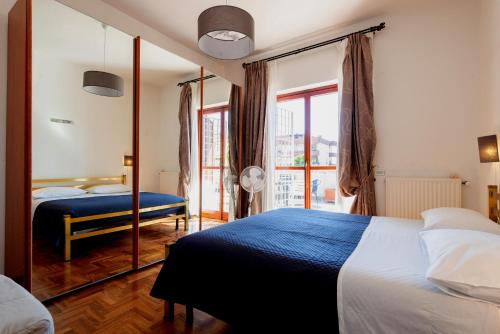 a hotel room with a bed and a mirror at Pit stop in Villa nel Verde a Roma-Aeroporto di Ciampino in Rome