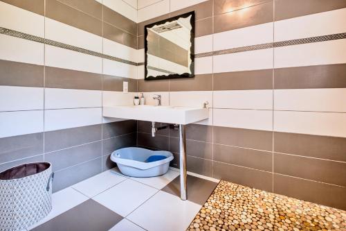 a bathroom with a sink and a toilet at La Chanconie in Chez le Turc