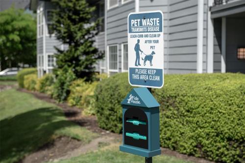 a sign in front of a house with a pet meter at Homewood Suites by Hilton Vancouver / Portland in Vancouver