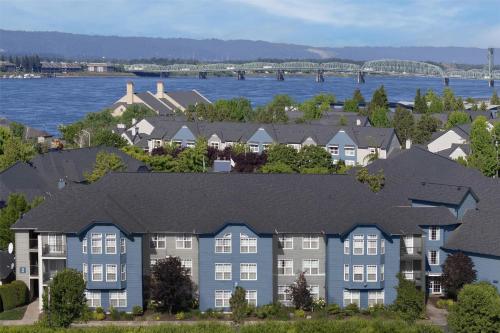 an aerial view of a row of houses in front of the water at Homewood Suites by Hilton Vancouver / Portland in Vancouver