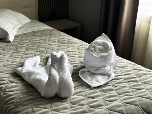 Postel nebo postele na pokoji v ubytování Grand Master Hotel
