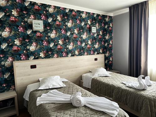 Postel nebo postele na pokoji v ubytování Grand Master Hotel