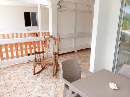 a room with a table and chairs and a table and a table and a table at Christina's Guest House OFFICIAL in Little Corn Island