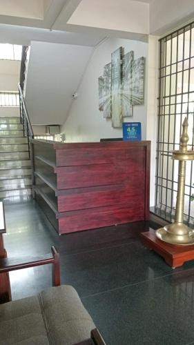 a room with a staircase and a stair case at Indeevaram Residency in Trivandrum
