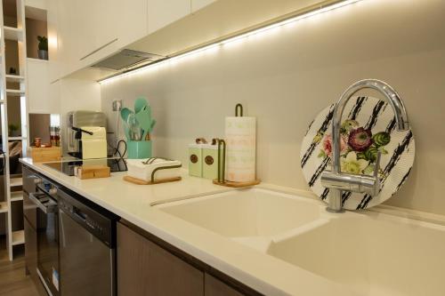 a kitchen with a sink and a faucet at My Nafpaktos Resort in Nafpaktos
