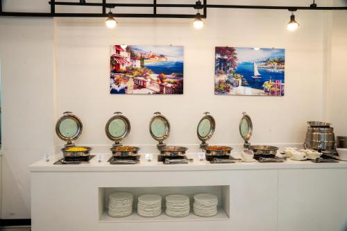 a counter with pots and pans and mirrors at Hallim Resort in Jeju