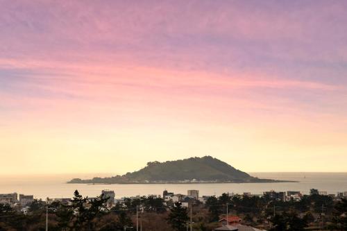 a view of an island in the water at Hallim Resort in Jeju