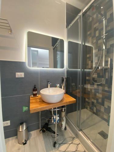 a bathroom with a sink and a shower at Casa Letizia Pescara Centro in Pescara
