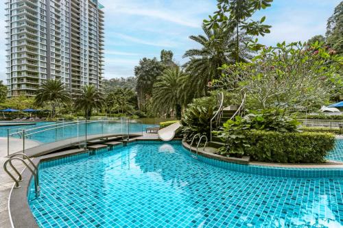 a large pool with a slide in a resort at TUI BLUE The Haven Ipoh in Ipoh