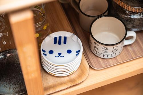 a cup of coffee sitting on a shelf at KAYO NIJO Hotel in Kyoto