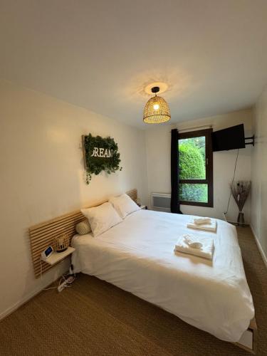 Łóżko lub łóżka w pokoju w obiekcie Greenloft La tonnelle