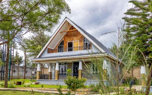 a small house with a gambrel roof at The Cabin Azure in Naivasha