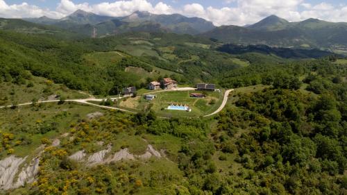 an aerial view of a house on a mountain at AGRITURISMO BUON VENTO, Appartamento PICCOLI SOLI una chic country house in Gubbio Italy in Gubbio