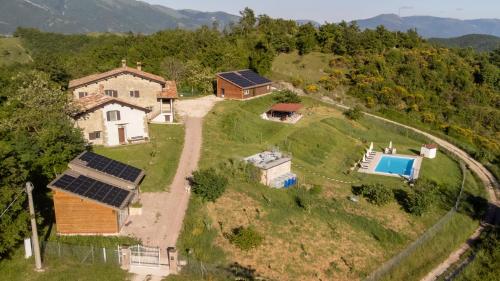 an aerial view of a house with solar panels at AGRITURISMO BUON VENTO, Appartamento PICCOLI SOLI una chic country house in Gubbio Italy in Gubbio