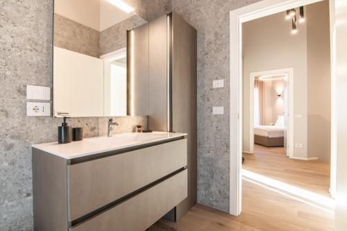 a bathroom with a sink and a mirror at Villa Sabrina in Colico
