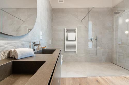 a bathroom with a sink and a shower at Villa Sabrina in Colico