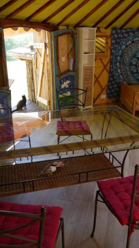 a room with two chairs and a table in a room at gîte de l'aigle in Aouste-sur-Sye