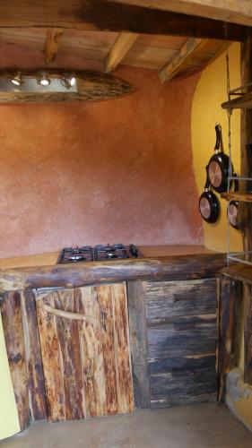 a kitchen with a wooden counter in a room at gîte de l'aigle in Aouste-sur-Sye