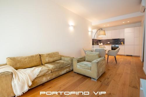 a living room with a couch and a chair at Chez Vous by PortofinoVip in Rapallo