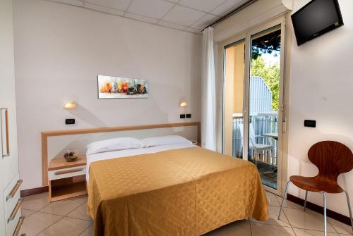 Postel nebo postele na pokoji v ubytování Hotel Giuliana
