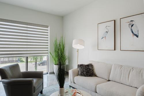 a living room with a couch and a chair at Modern 2BR, Family-Friendly in FLL, Near Beach! in Fort Lauderdale