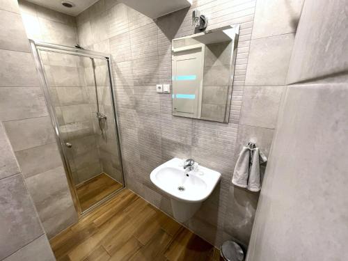 Ένα μπάνιο στο Apartamenty Listopadowe